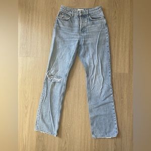 Straight leg light wash jeans with distressing